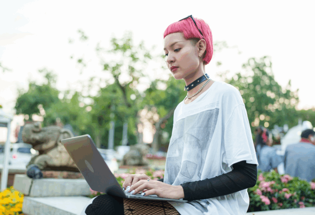 Young woman working on a laptop in a public place